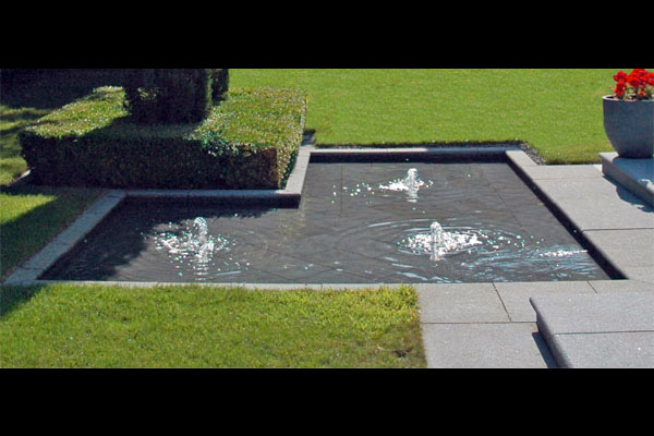 This large formal water feature is shallow and child-friendly with a contemporary finish