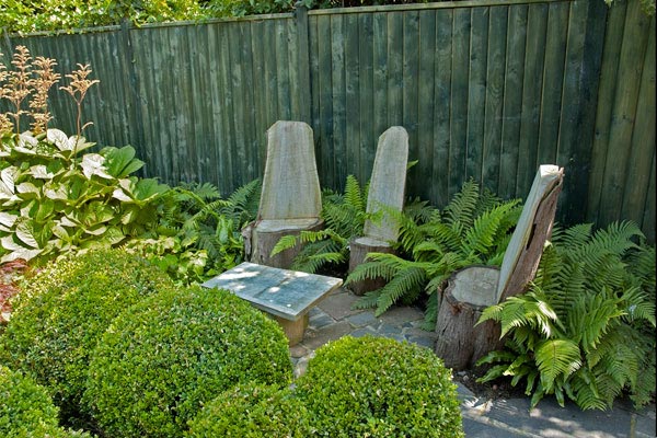 Childrens chairs and a table were formed from the stumps of three existing trees