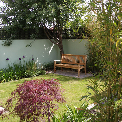 With carefully selected plants and furniture add the finishing touches to this simple design