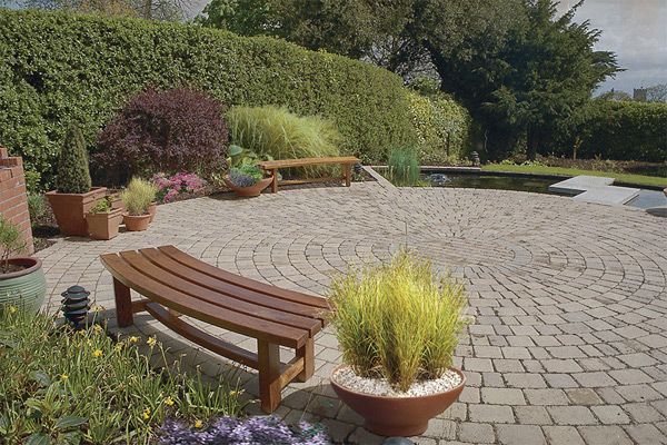 Bespoke garden furniture and container planting add comfort and elegance to the garden